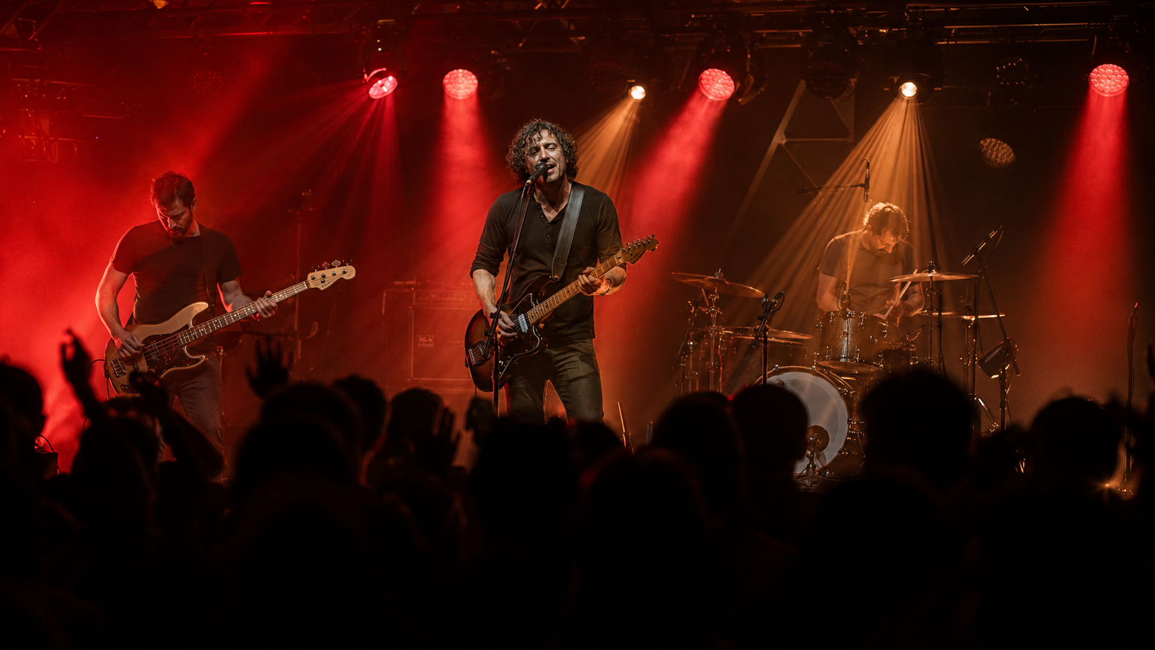 Live rock performance under dramatic stage lights